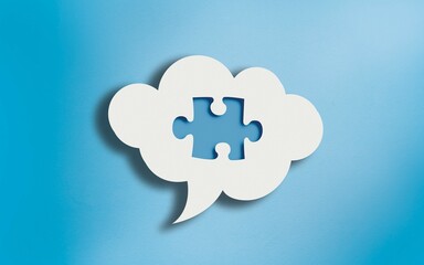 Jigsaw Puzzle Icon in White Cloud Speech Bubble on Blue