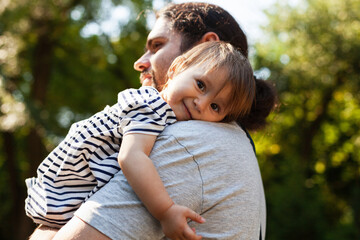 Happy father's day. Man playing with a child. Joyful dad plays with a kid. Dad loves baby. Male tenderess concept.
