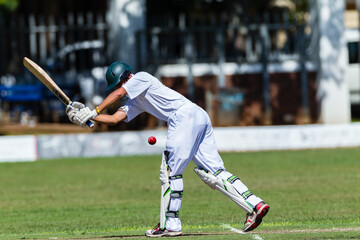 Cricket Batsman Unrecognizable Plays Red Ball  Close-Up Action. - 503451616