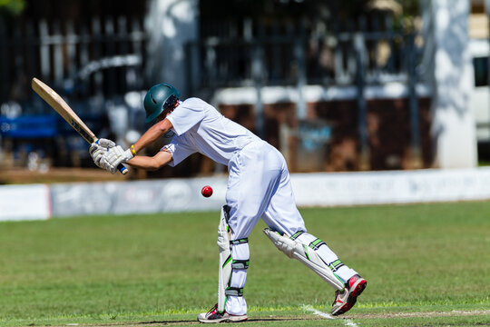 Cricket Batsman Unrecognizable Plays Red Ball  Close-Up Action.