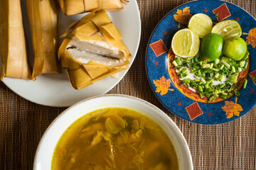 Rice cake (Ketupat) is Cooked Rice packed inside a diamond-shaped container of woven palm leaf pouch for Moslem Celebration. Eid Mubarak concept. Indonesian traditional food.