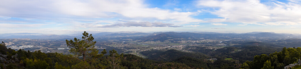 Fototapeta na wymiar Panoramic view of the mountains of Galicia and Portugal from the forest park Monte Alba. Spain
