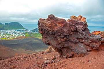 Extinct volcano eldfell on the background of the island Heimaey. Vestmannaeyjar Archipelago. Iceland