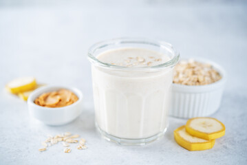 Peanut butter oats banana smoothie in a glass