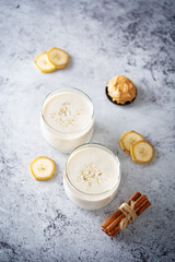 Fototapeta na wymiar Peanut butter oats banana smoothie in a glass