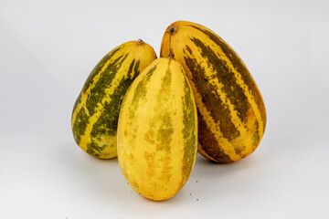Vellery  Trichosanthes dioica, also known as pointed gourd, Vegetable, Orange and Green stripes, healthy food, isolated in white background, 3 pieces, studio lighting