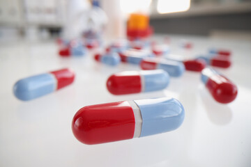 Bunch of colourful medications on tablet, pills and capsules on surface