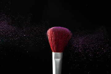 Close up of blusher brush with powder sparkler
