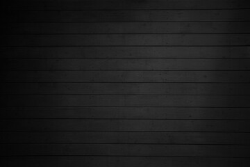 Black wooden background or texture