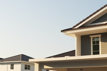 Image of country home with roof and windows on freshness summer blue sky morning sunshine for property business presentation and report background.