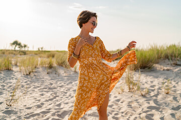 stylish attractive slim smiling woman on beach in summer style fashion trend outfit