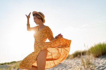 stylish attractive slim smiling woman on beach in summer style fashion trend outfit