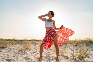 stylish attractive slim smiling woman on beach in summer style fashion trend outfit