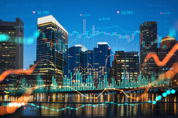 City view panorama of Boston Harbor and Seaport Blvd at night time, Massachusetts. Financial downtown. Glowing FOREX graph hologram. The concept of international trading and fundamental analysis