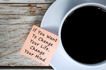 Motivational and inspirational quote on notes with coffee cup
