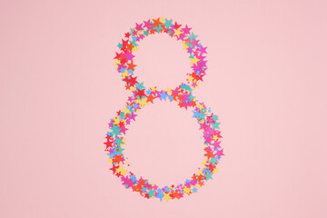Number 8 or eight made from decorative multi-colored stars. Top view