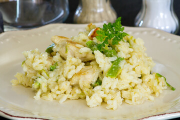 chicken and green asparagus risotto on a plate