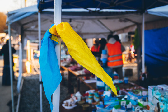 A handkerchief in the colors of the national flag of Ukraine as a symbol of victory is tied to the shelter. Ukrainian refugees head to EU border