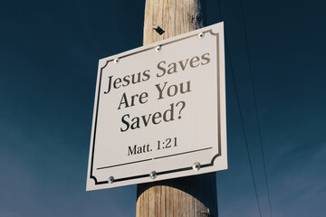 Jesus saves sign on telephone pole promising salvation - obrazy, fototapety, plakaty