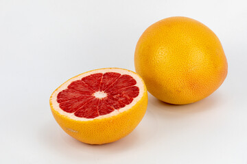 Fresh Grapefruit  Blood orange - a variety of orange with crimson, almost blood-colored flesh, Citrus into sinensis, raspberry orange, with crimson, isolated in white background with copy space