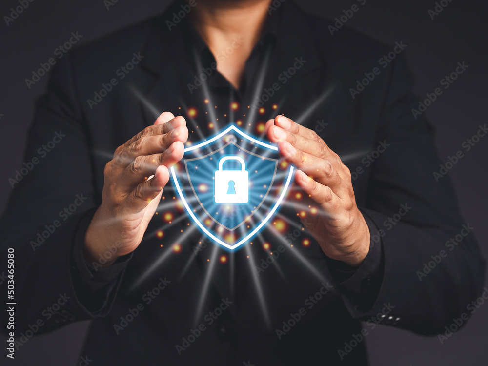 Poster data encryption. businessman protecting data personal information on a virtual interface