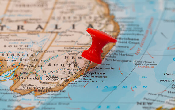 Pinning at location Sdyney, big city of NSW, travel map with push pin point marker closeup, Australia journey concept.