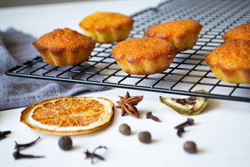 cupcakes on a black iron grate on a white background