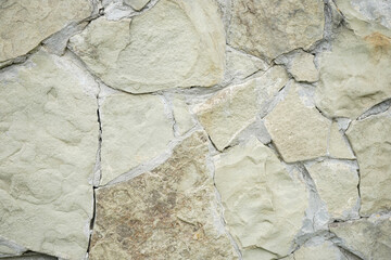 Stone wall as background or texture. The texture of the stone wall.