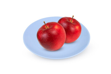 Red apples on a plate on an isolated white background