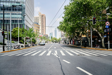 SHANGHAI, CHINA - APRIL 21, 2022: Empty and quiet street around Middle Huaihai Road in lockdown