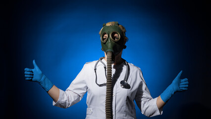 doctor woman in gas mask and gloves shows two thumbs up on blue background