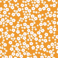 Seamless vintage pattern. Little white flowers. Orange background. vector texture. fashionable print for textiles, wallpaper and packaging.