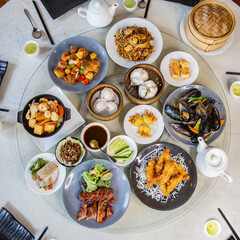 Top view food platter combo set of traditional Cantonese yum-cha dim sum Asian gourmet cuisine meal...