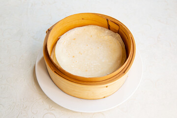 Steam basket container for roast Peking duck roll roti bread of traditional Cantonese yum-cha Asian...