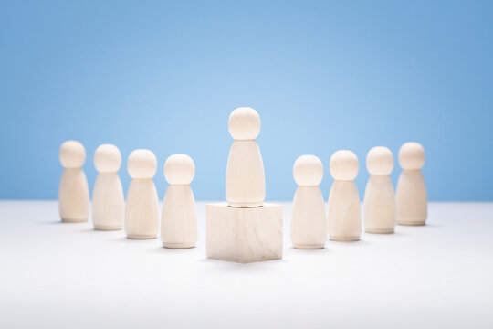 Leadership, Wooden Business Team With One Person Standing Out From The Crowd
