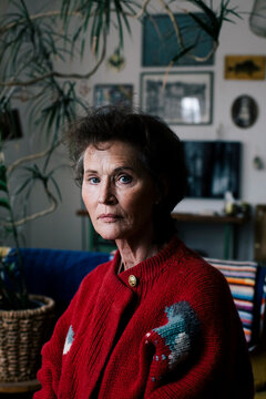 Portrait of senior woman in sweater at home
