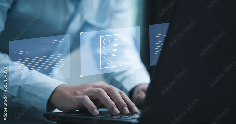 Poster Hand using laptop computer with virtual screen and document for online approve paperless quality assurance and ERP management concept.