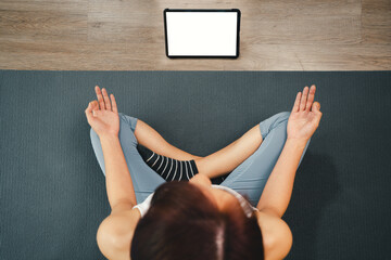 Yoga course at home with Technology tablet online, Top view of young woman sitting on yoga mat and...