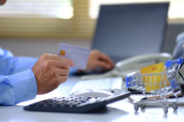 Online Payments, Businessman Hand Using Credit Card Payments, Online Payments Human hands handle credit cards and utilize a laptop to shop online.