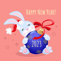 Symbol of 2023 Rabbit in blue tones with a Christmas ball on a terracotta background