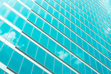 underside panoramic and perspective view to steel blue glass high rise building skyscrapers