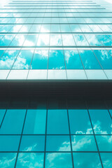 underside panoramic and perspective view to steel blue glass high rise building skyscrapers