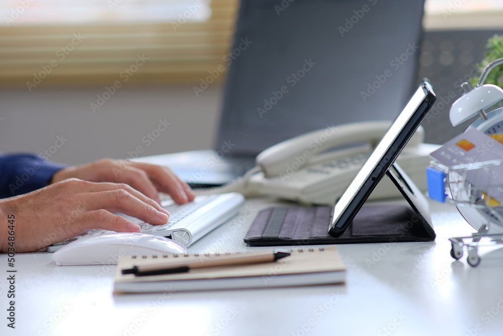 Aufkleber close-up of a man typing on a computer keyboard, a businessman or a student using a laptop at home. 