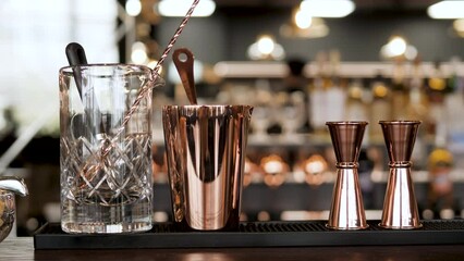 bartender's tool for making cocktails. jigger, shaker, strainer, bar spoon and more. beautiful tool for the job. close-up