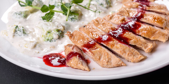 Close Up Of Grilled Duck Breast Covered With Sweet Red Fruit Sauce