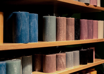 Candles for sale in the interior decorating store, close up.
