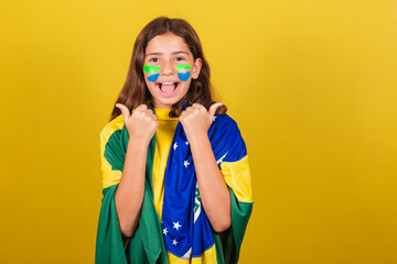 brazilian, caucasian child, soccer fan, thumb up. approving, approval, affirmative. World Cup....