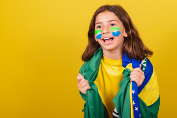 Brazilian caucasian child soccer fan celebrating. World Cup. Olympics.