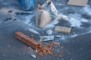 Various masonry and brickwork tools being used on a construction site