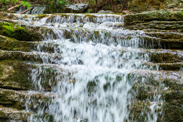 Mountain watercourse. Abundance of water, saving and use of water resources. Contrast of drought. 
